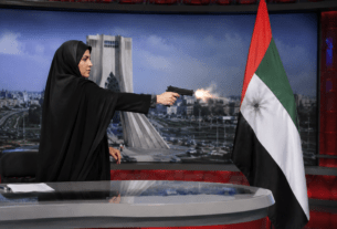 International Outrage! Iranian TV Anchor Fires AK-47 Rifle at UAE Flag on Live Broadcast!