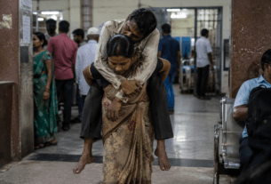 Tribal Woman Carries Husband with Brain Stroke on Her Back Due to Lack of Stretchers!