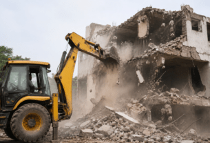 NEET Paper Leak Case: Bulldozers Raze Illegal Construction Linked to Accused P.V. Kulkarni in Beed.
